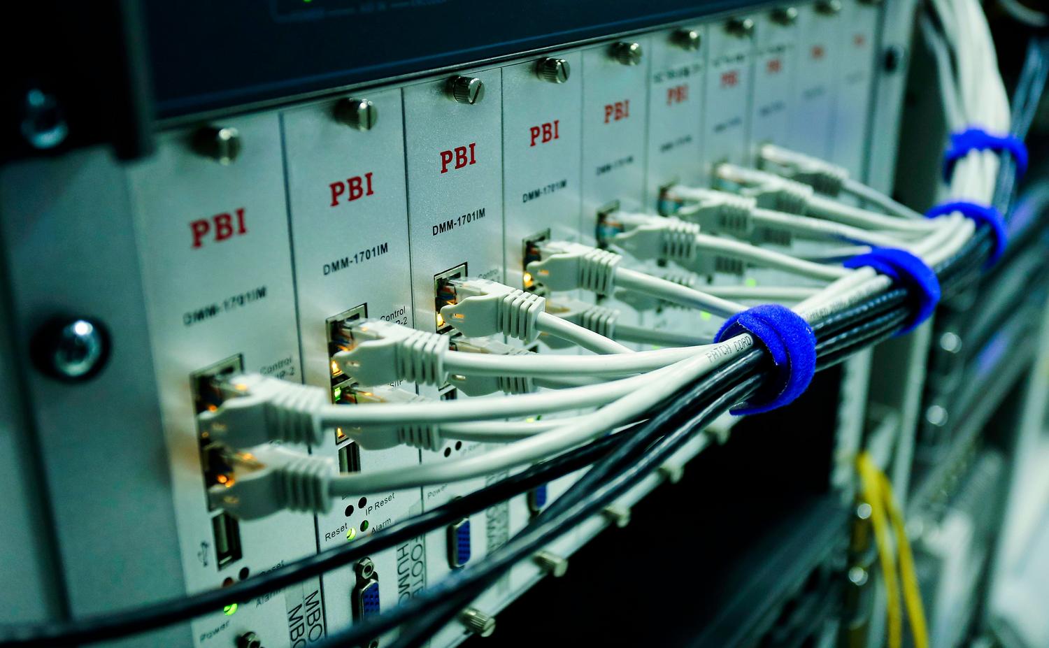 Network switch with connected Ethernet cables, illustrating the core of a home network