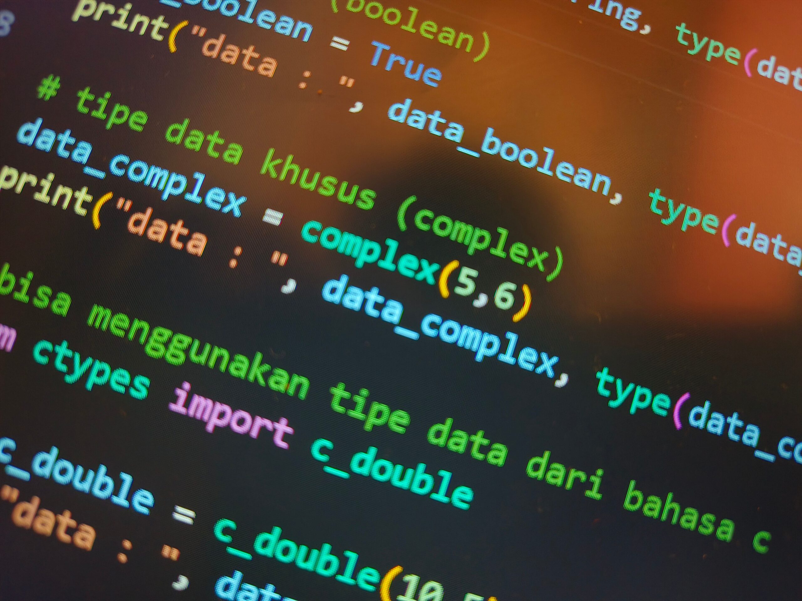 Detalle de sintaxis de programación en Python con resaltado de colores en un entorno de desarrollo moderno.