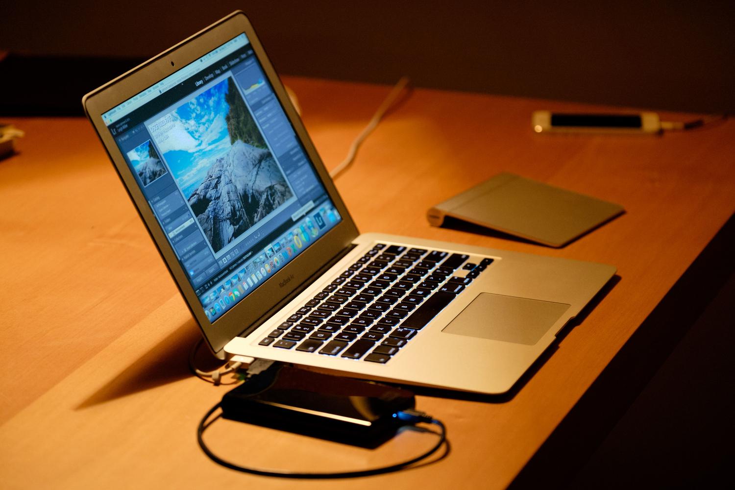 Sleek laptop on a wooden desk, representing a healthy work environment for device longevity. Sleek laptop on a wooden desk, representing a healthy work environment for device longevity.
