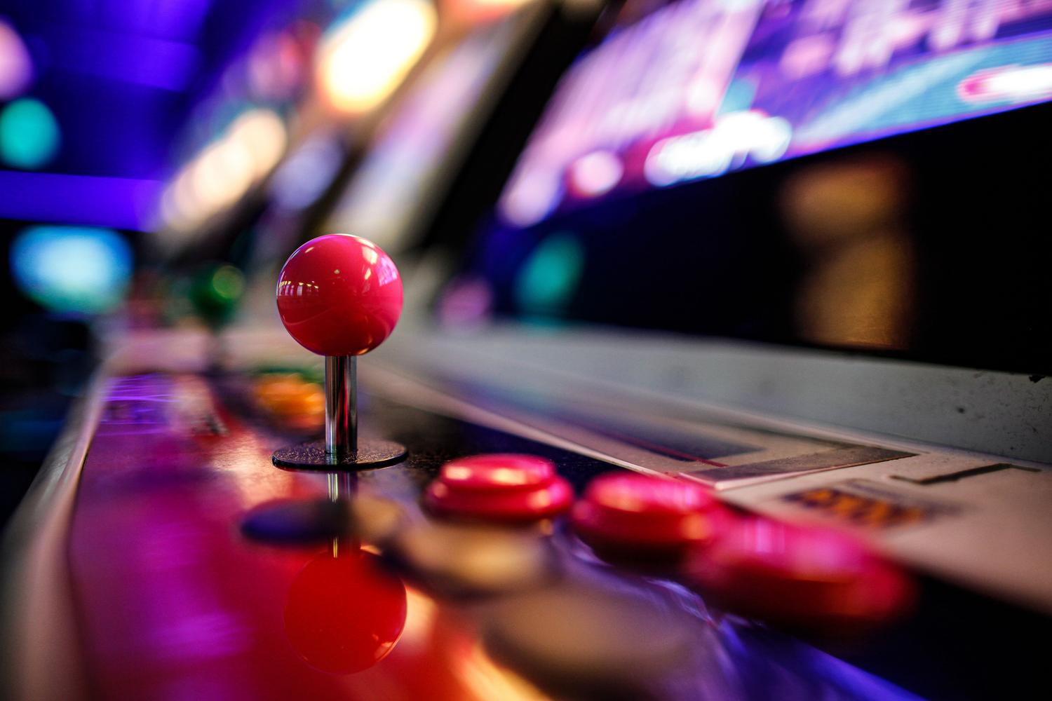 Close-up of arcade joysticks and buttons, illustrating the arcade experience brought to PC.
