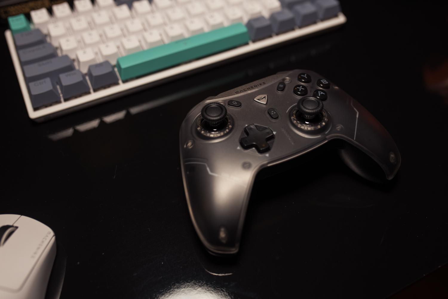 Gaming controller and keyboard on a desk, highlighting the controller mapping and XInput configuration.