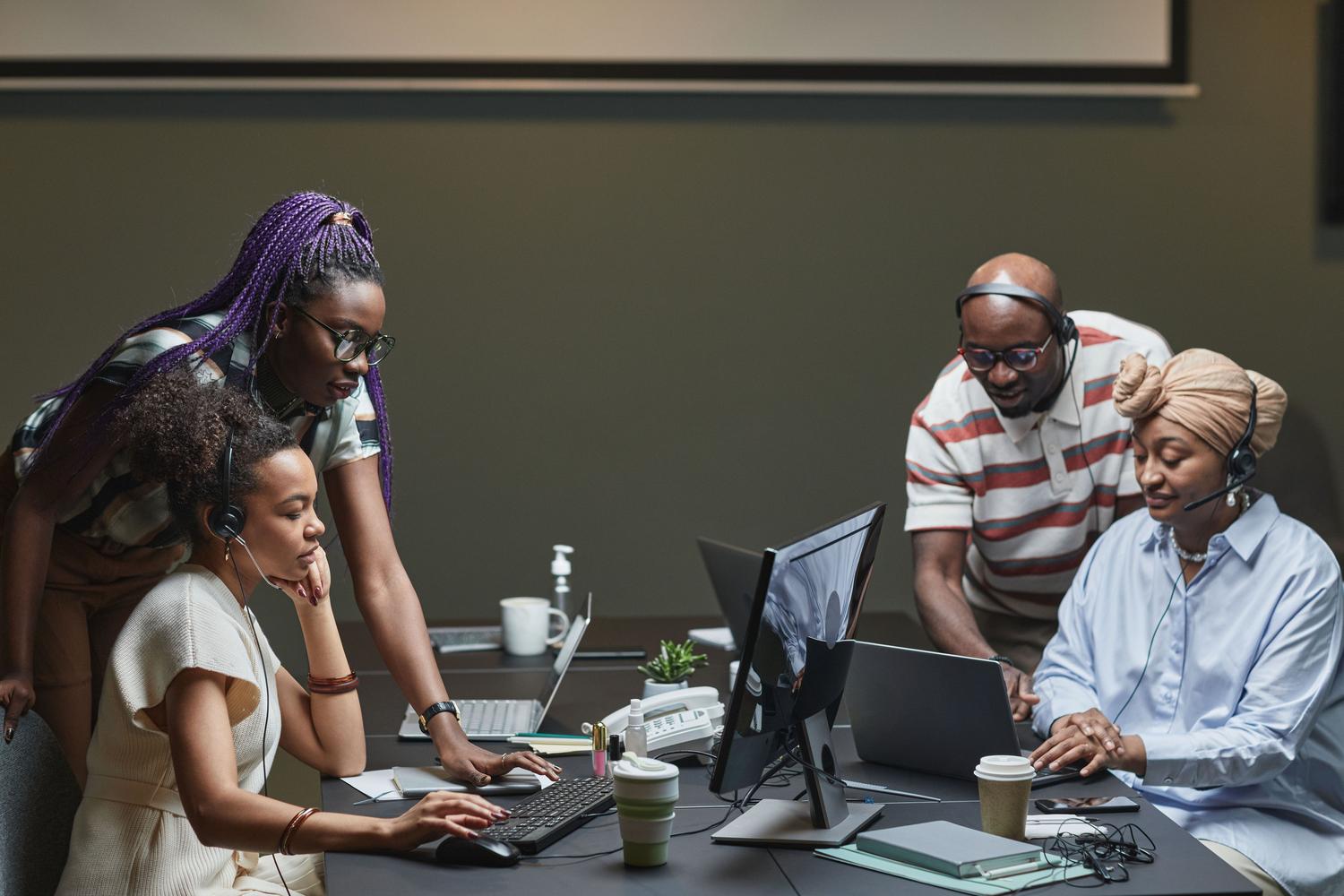 A diverse professional team collaborating in a modern office, representing co-creation and diversity in AI development. A diverse professional team collaborating in a modern office, representing co-creation and diversity in AI development.
